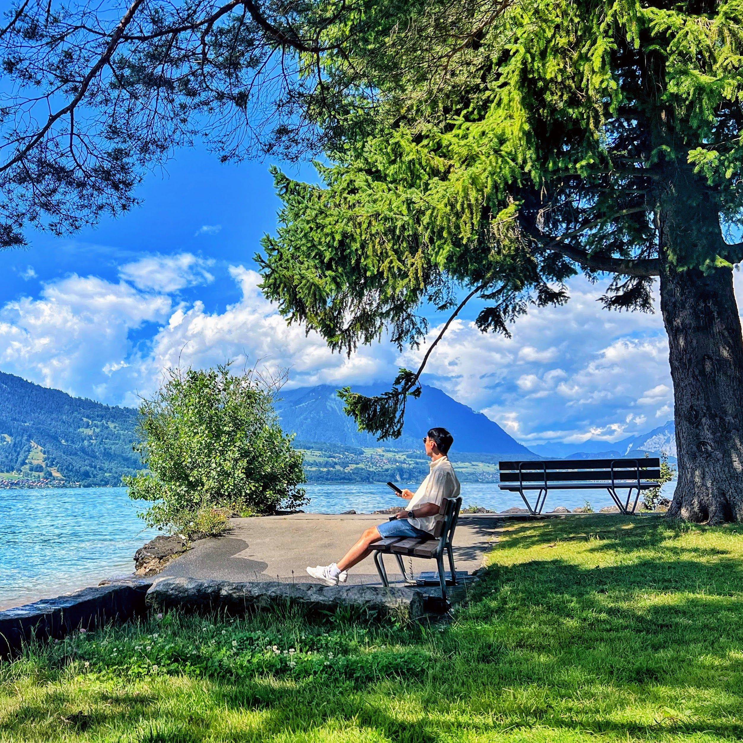 Minsoo Kim sitting by a lake